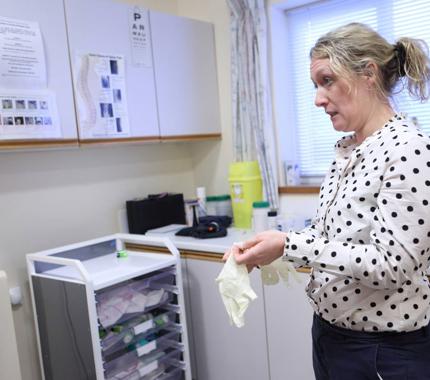 Female GP in surgery