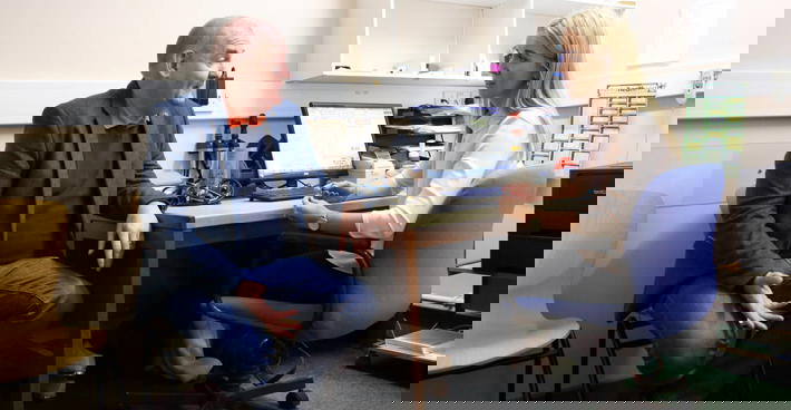 Female GP consulting with patient