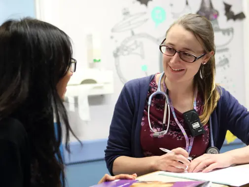 Two doctors talking on ward